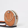 Beige ring handle circle cross body bag