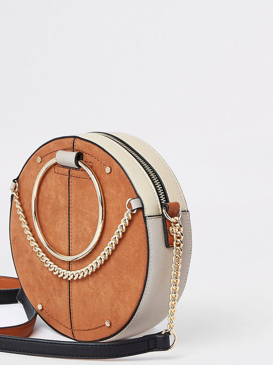 Beige ring handle circle cross body bag