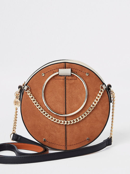 Beige ring handle circle cross body bag